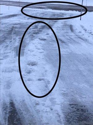 Packed snow chunks left in drive after plow service. Snow left mounded at curb