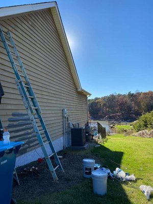 This client wants to preserve there siding for a few more years so we gave this lake house a brand new look!