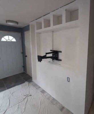 This project included drywall finish on a conversion of a flat wall into a built in entertainment center.