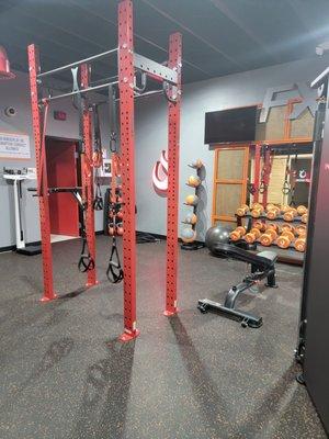 Workout area the red door is the restroom with the shower