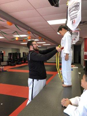 Karate kids celebrating a new belt