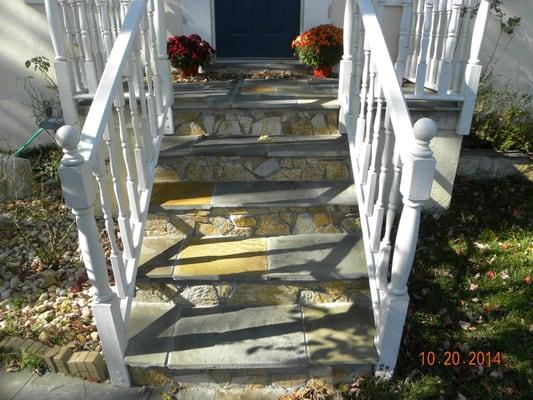 various sizes of regular Pennsylvania stones on stairs and stoop combine with Idaho irregular flagstones on step risers...