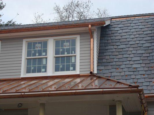 Copper gutters with roof