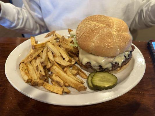 A burger and fries.   Markle Burger Markle Burger with bacon and fries.