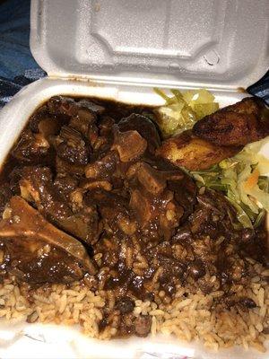 Braised Oxtails (extra gravy) rice &peas cabbage and plantains. Good and meaty not a lot of fat on these oxtails either.