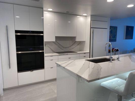 Cabinet refacing in High Gloss White Lacquer Finish and Cambria Quartz Counter Tops