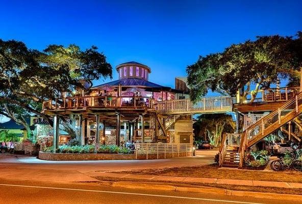 A treehouse built in front of an existing restaurant in New Smyrna Beach.