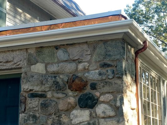 Fiberglass/Wood replica gutter with copper round corrugated downspouts