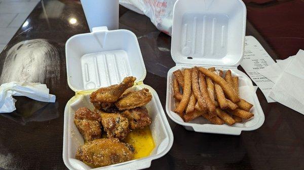 Garlic parmesan 6 piece wings and funnel cake fries.