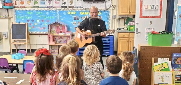 Father Joe visits the preschool students.