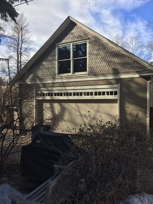 Here is the job complete with new window above garage door and painted.