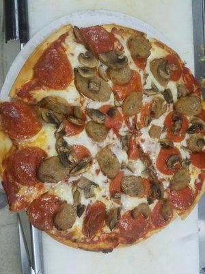 Pepperoni, sausage, mushroom pizza