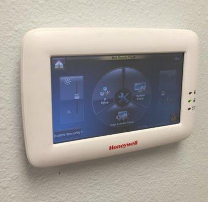 A touchscreen intrusion keypad makes it easy to set your alarm or see if there are any alerts or open zones.