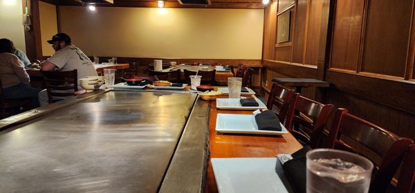 A family sat at our table, ordered, then walked out. We were two for a sushi dinner, and they sat us at this empty hibachi table.