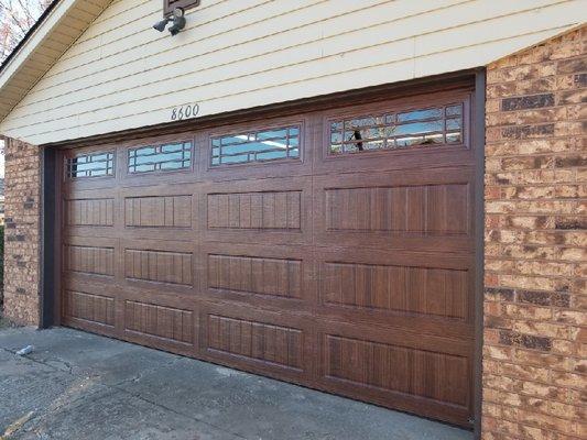 Residential Garage Door with Long Bead Board Panel Design and Prairie Window Design in Mahogany Stain