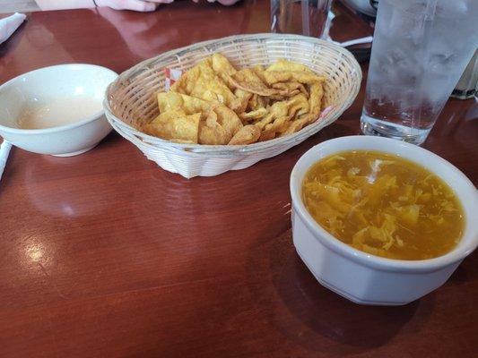 Egg Drop soup and wonton chips with dip.