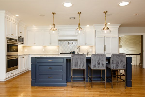 Kitchen remodel using existing cabinetry, light carpentry and cabinet painting.