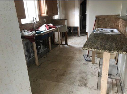 Kitchen after all water damaged cabinets removed.