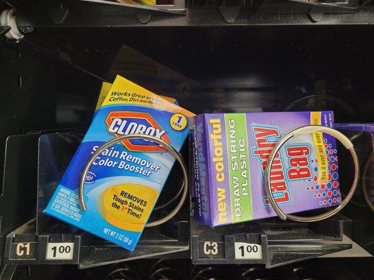 $1 for bleach, and reusable laundry bags.  Just in case you forget yours.  Vending machine takes quarters.