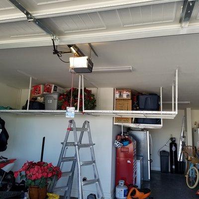 Complete garage over head shelving.