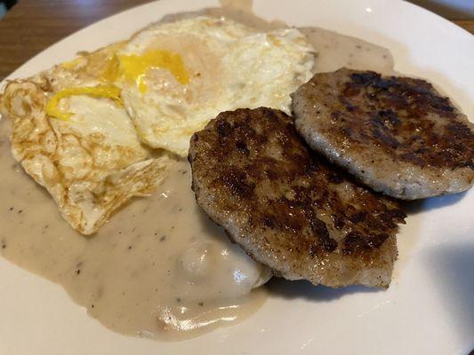 Biscuits and gravy, 2 eggs over easy and sausage patties