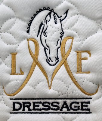 A logo that we embroidered on a saddle pad.