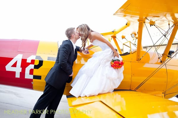 Palm Springs bride and groom during a creative portrait session with vintage airplanes!