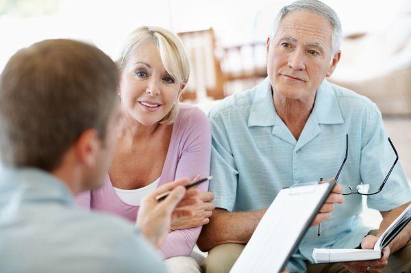 A couple discussing Medicare supplements with their advisor.