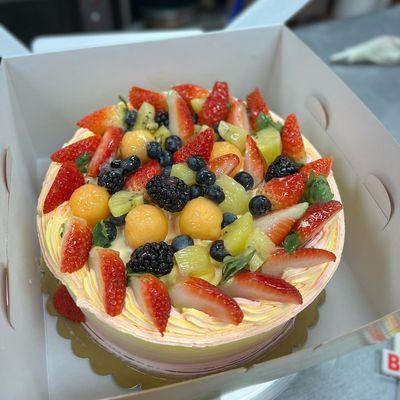 A 8" cake with extra extra fruit on top