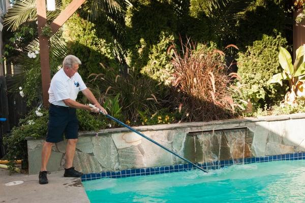 Rich in action servicing a pool in Roseville