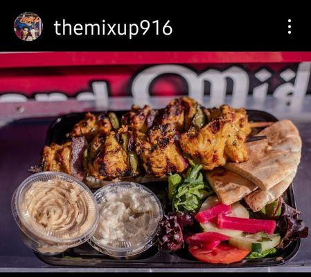 An amazing chicken Kabob plate, Feta cheese salad,palestinian rice,humas and garlic spread..