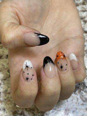 Capture the moon and star simple nails design Dipping powder French Orange Black and White tips.