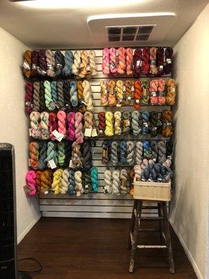 Wall of hand dyed yarns.