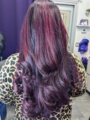 Hair was lightened and then violet tones were added