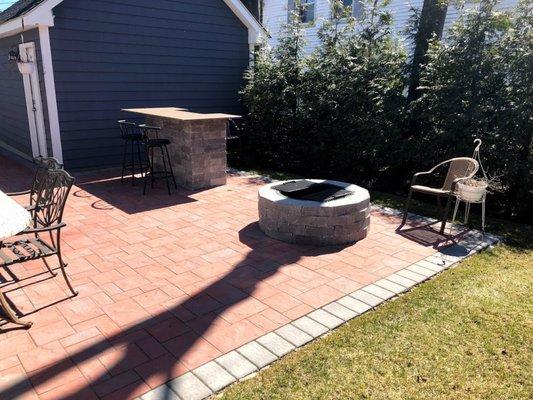 Fire pit and bar on the patio.