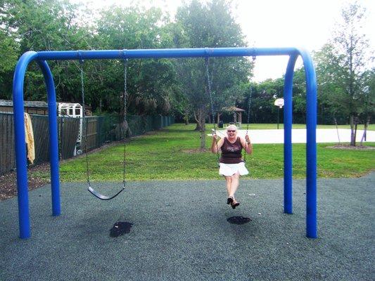 Scruffy person on swing