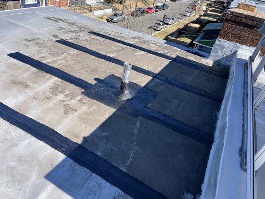 Completed work (fixed leak along with adding protection at seams where water sits on flat roof)