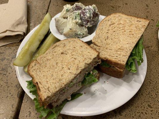 Chicken salad sandwich (minus the tomatoes plus the other plate's pickle) and a side of red skin potato salad