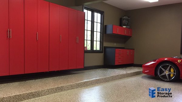 Epoxy floor and garage storage cabinets in Leawood to compliment the nice car!