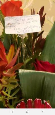 Flowers with poorly hand written note.