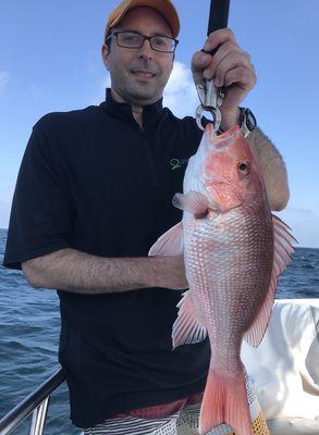 Catching beautiful red snapper on the reef