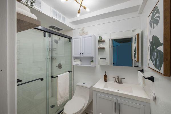 New walk in shower, which was done beautifully and carefully selected to match the wave textures. Also new ceiling light & bathroom vanity.