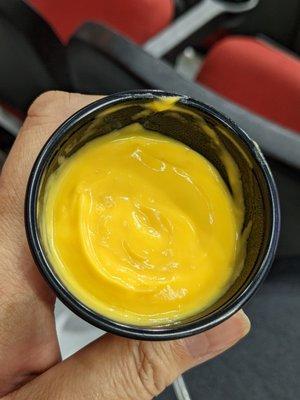 Cheese sauce. It has a mild spicy kick to it.