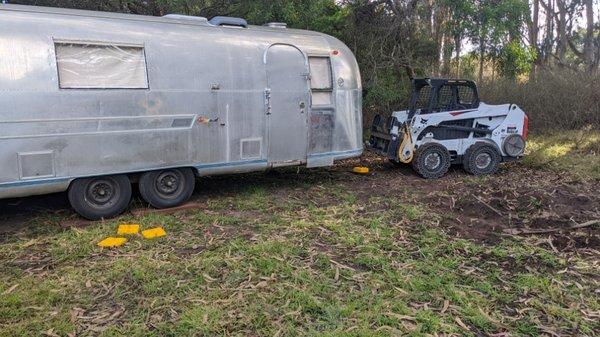 Tucking an airstream into it's new resting place using our tight quarters bobcat.