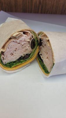 turkey cheddar olives lettuce on whole wheat wrap