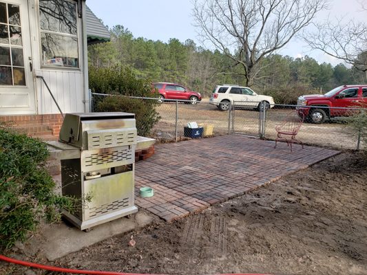 Leveled Ground  and installed pavers & flower bed.