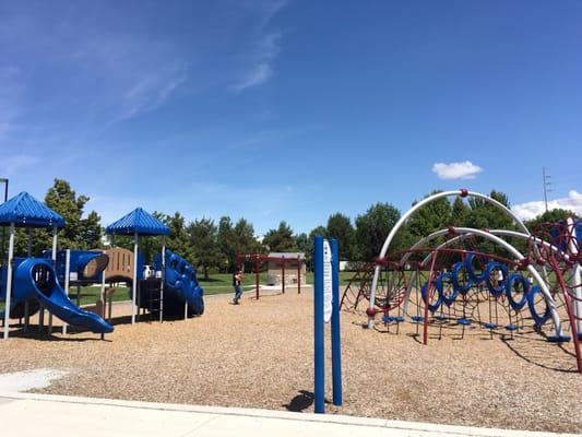 Ages 2-5 on the left and 5-12 on the right.  It's a great little park with a large field of grass!