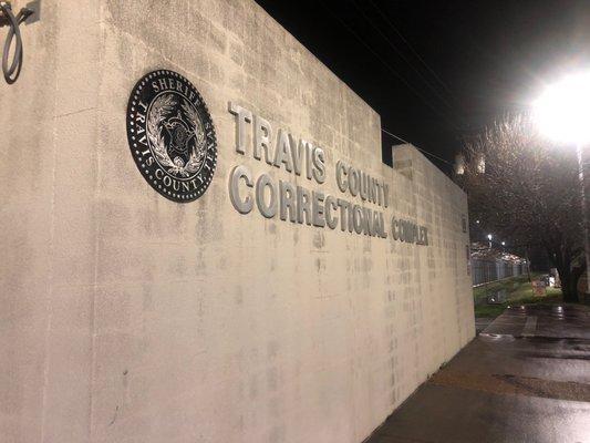 This photo is a sign in front of the main entrance of the Travis County Correctional Complex.