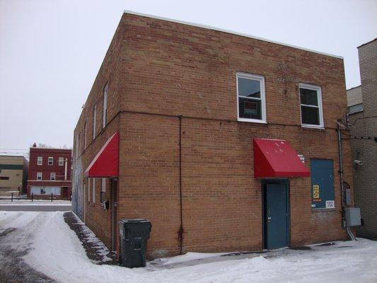 Back of the building -- back door and off-street parking, view looking southwest.