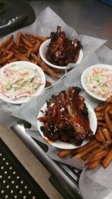 Smoked ribs off the Spit with coleslaw and frenchfries.  Many sides to choose from every Saturdays during warm weather.